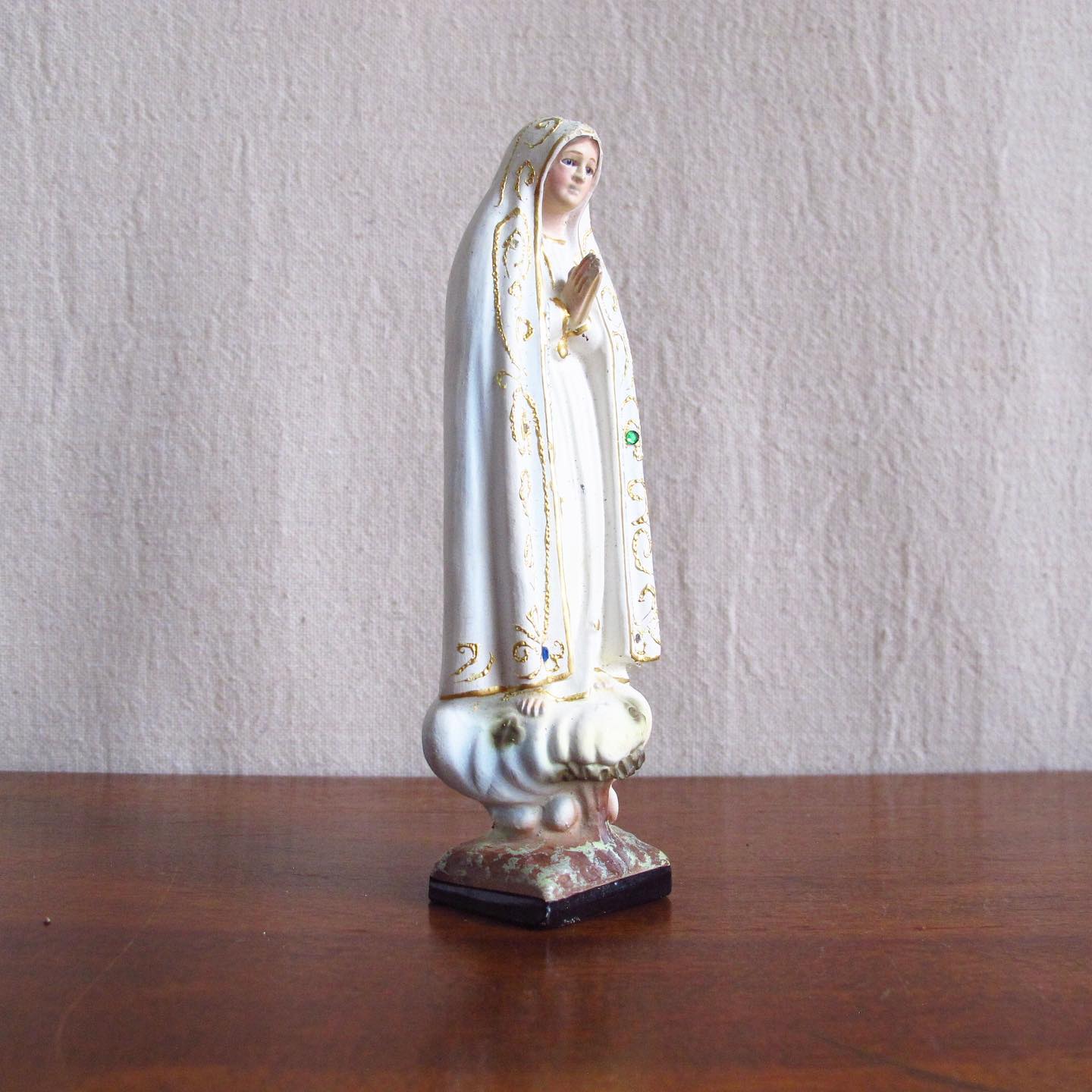 Chalkware or Chalk Madonna with inset glass eyes and scattered jewels, c. 1920
