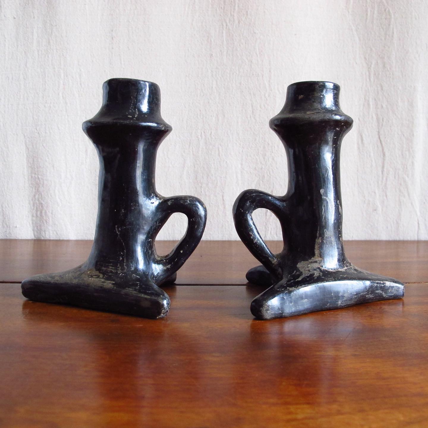 Pair of Southwest Santa Clara black Native American pottery candlesticks, c. 1920