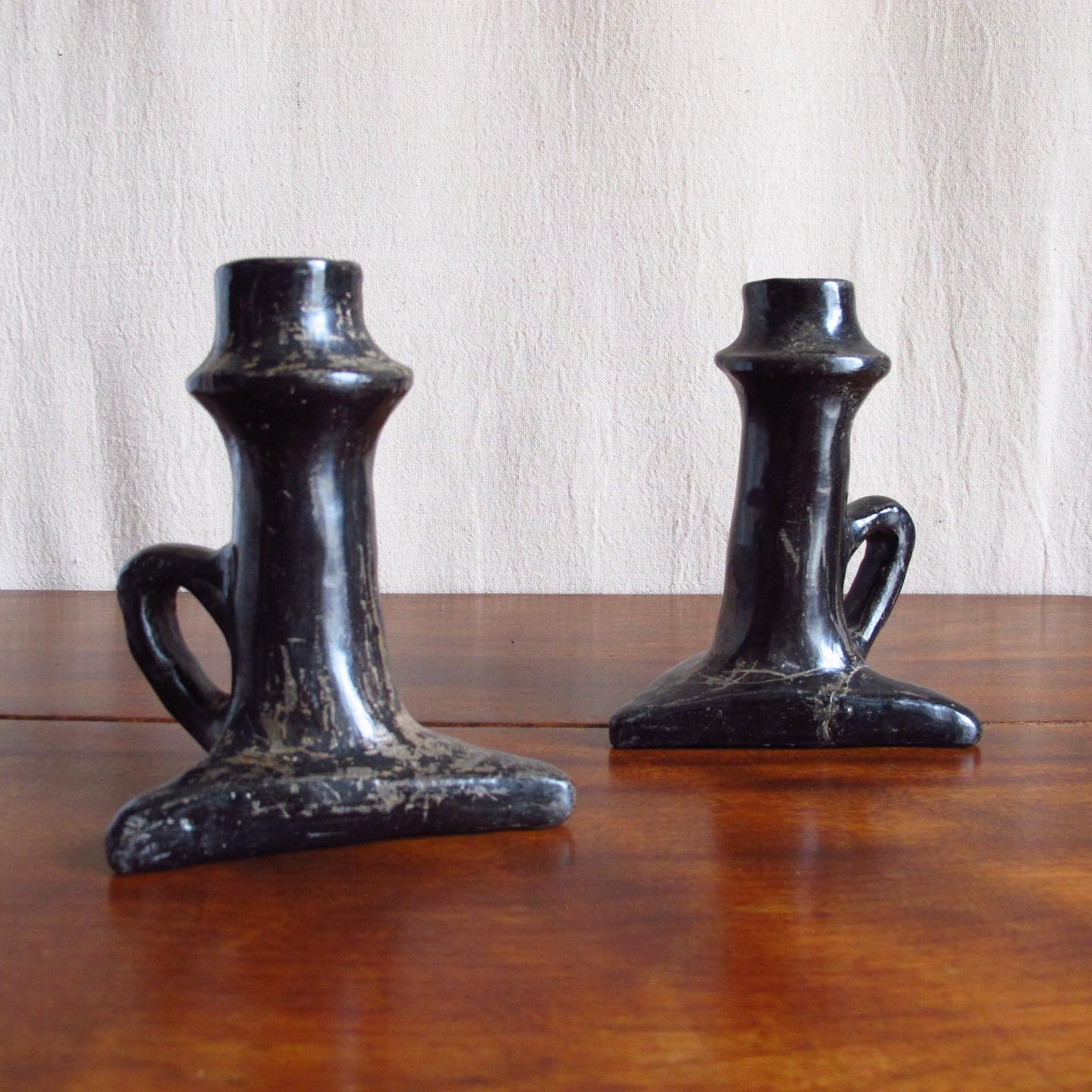 Pair of Southwest Santa Clara black Native American pottery candlesticks, c. 1920