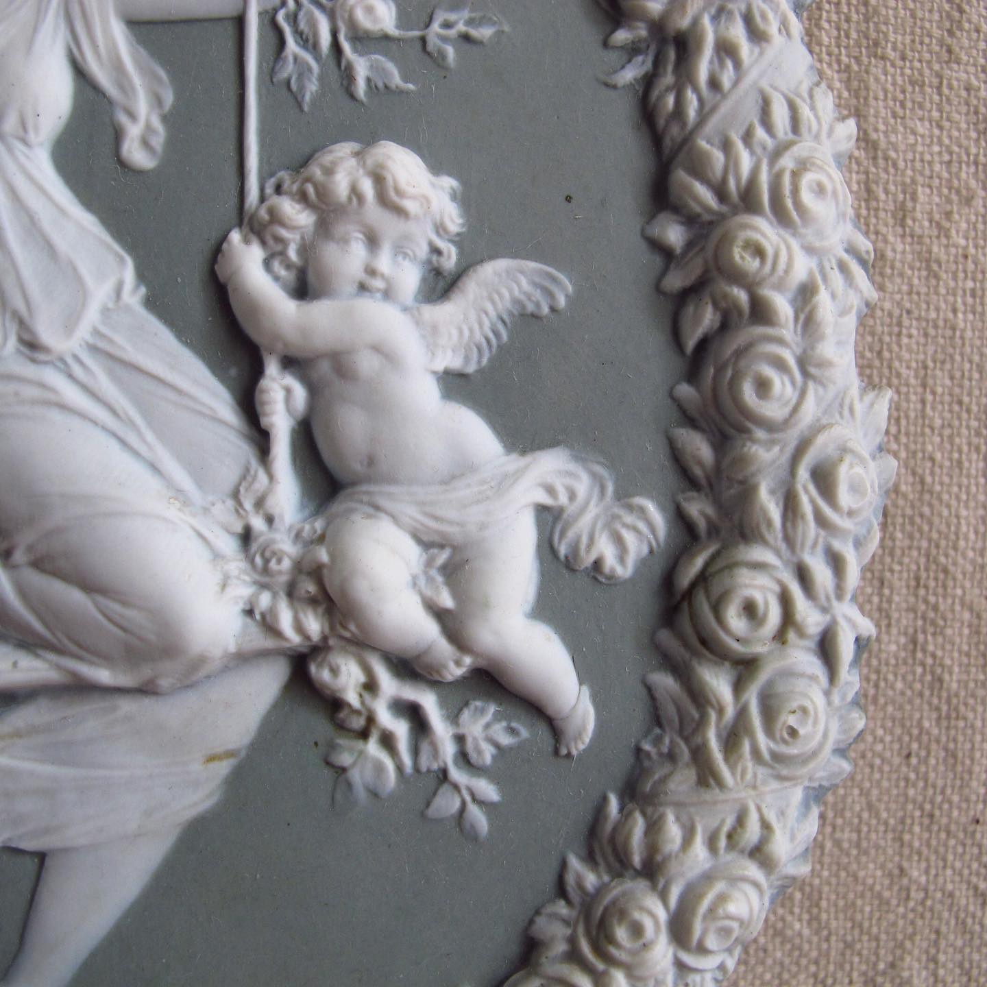 Victorian jasperware bisque relief with maiden and putti / cupid playing on a swing, in the manner of Wedgwood, c. 1890
