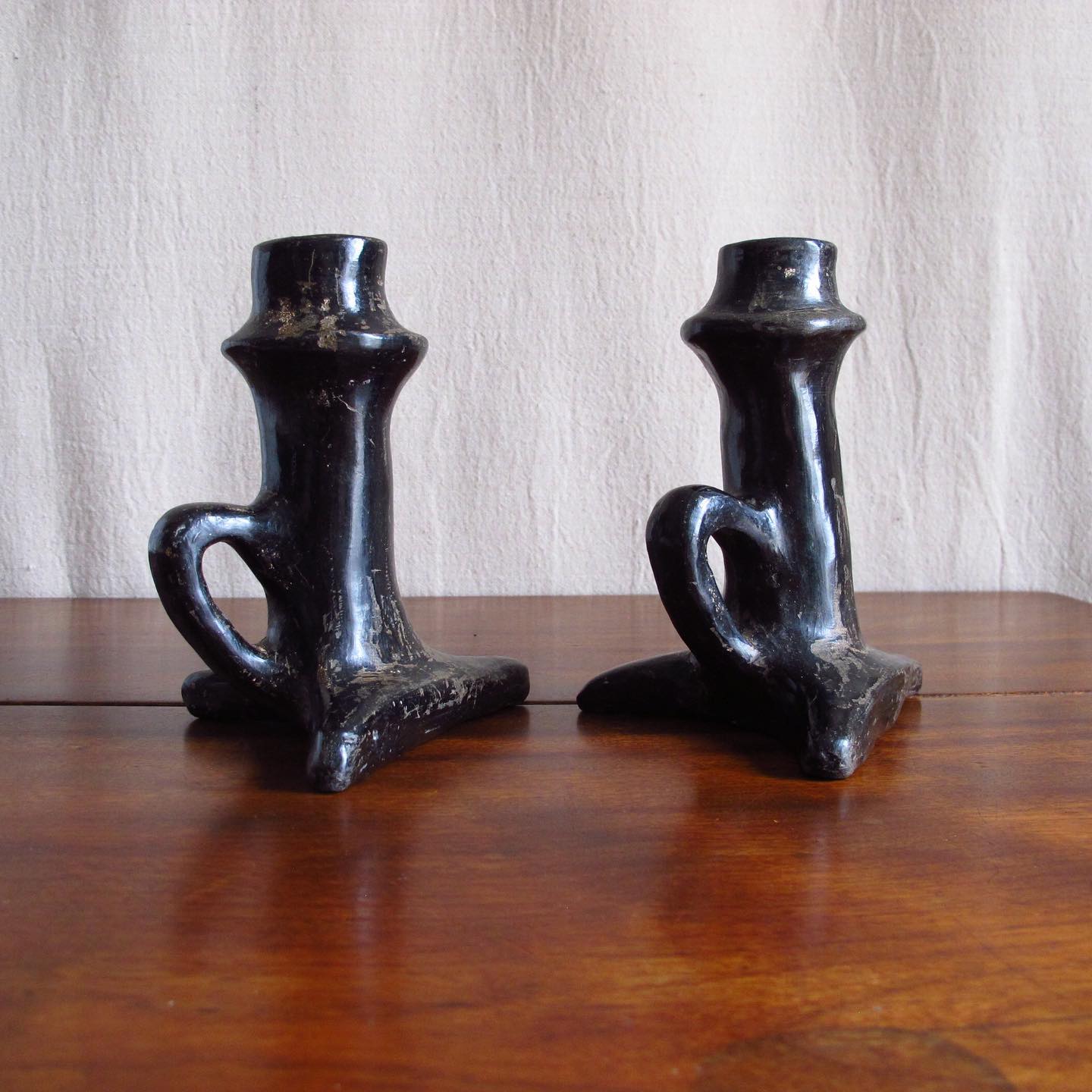 Pair of Southwest Santa Clara black Native American pottery candlesticks, c. 1920