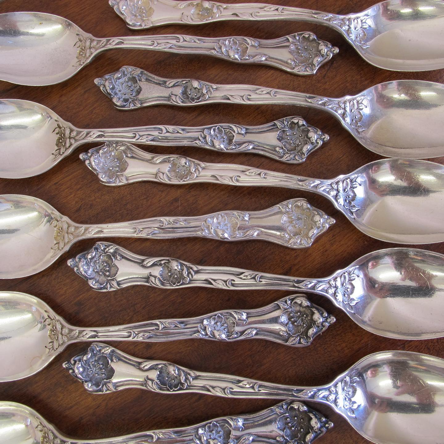 Ten Art Nouveau sterling silver Reed & Barton teaspoons, c. 1900, ‘Poppies’ pattern or possibly the ‘Les 5 Fleurs'