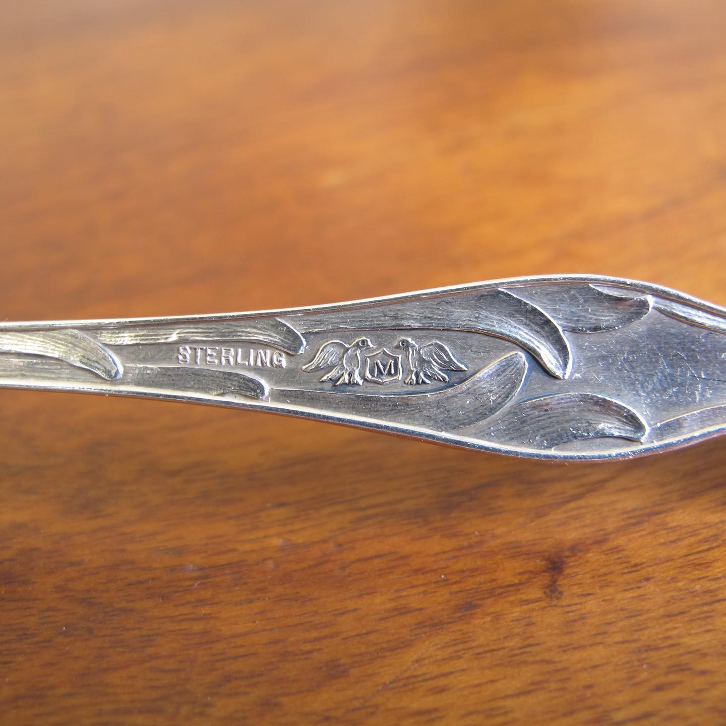 Sterling spoon slotted with stars, handle with daffodils in extraordinary detail, by MANCHESTER MFG. CO, c. 1905