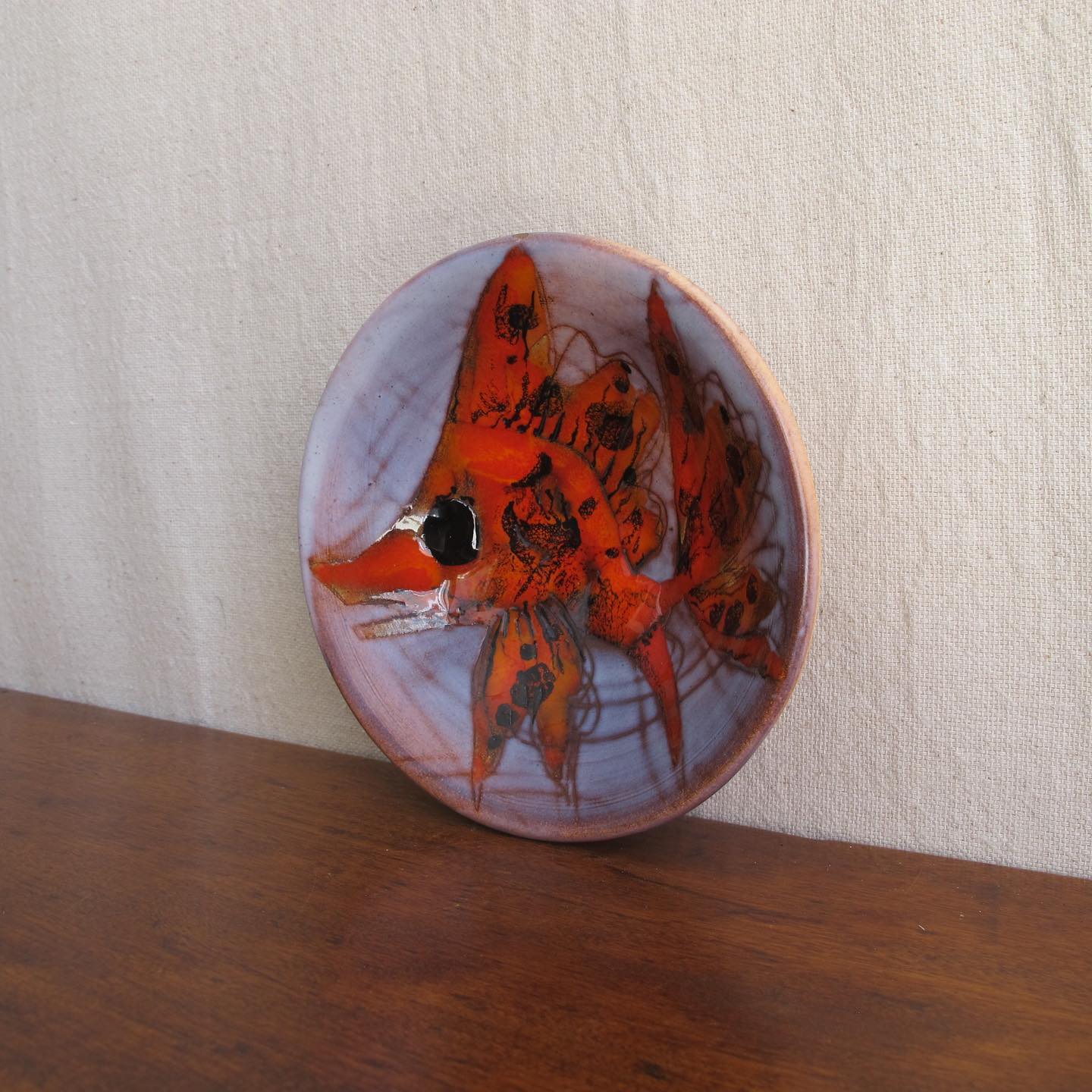 Vallauris French art pottery dish or bowl with goldfish or koi carp in brightly colored orange majolica glazes c. 1950 1960