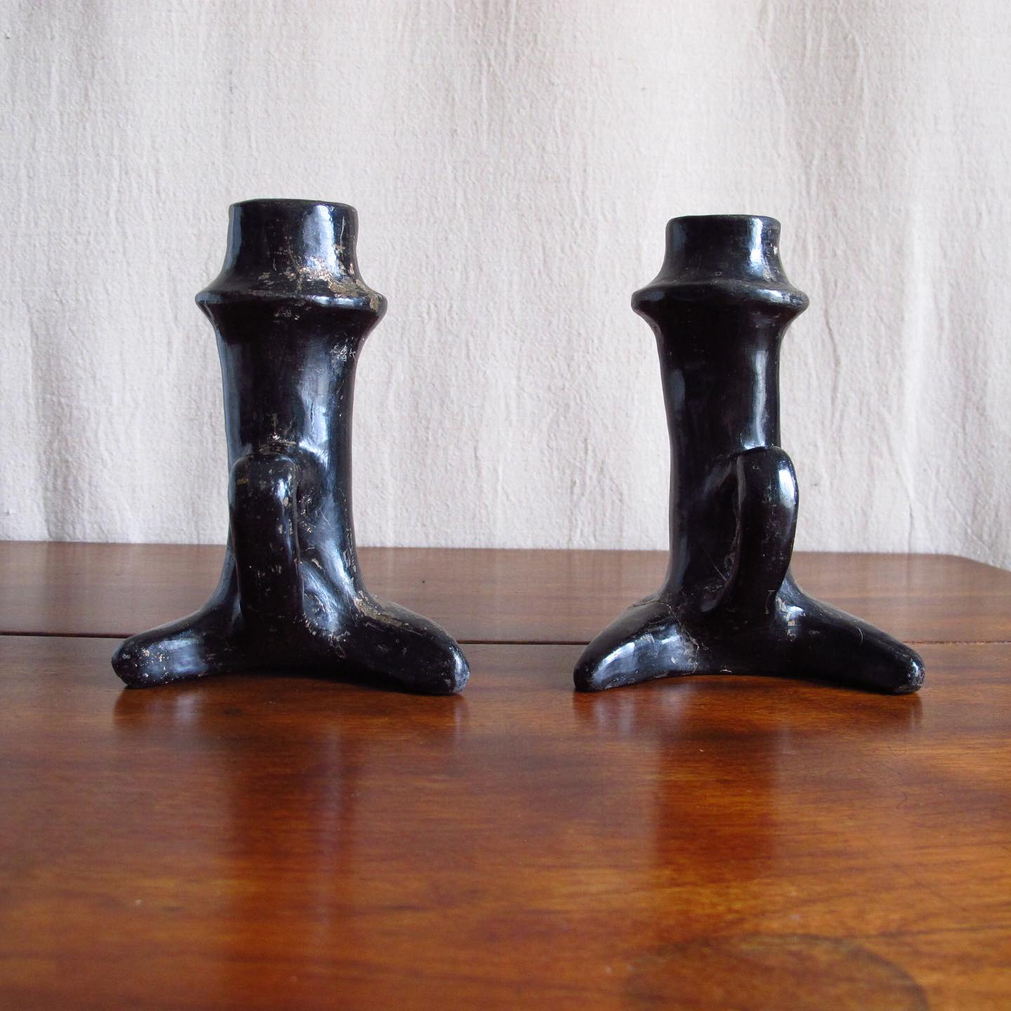 Pair of Southwest Santa Clara black Native American pottery candlesticks, c. 1920