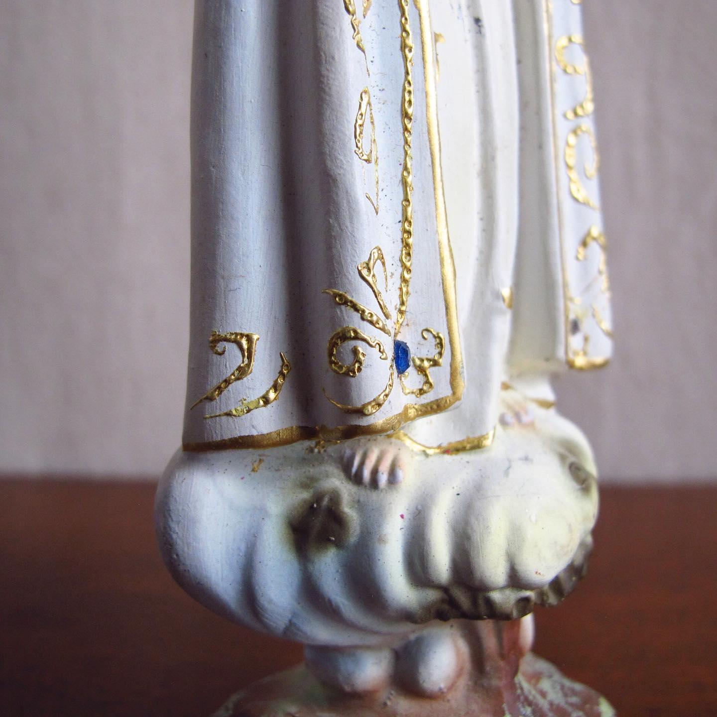 Chalkware or Chalk Madonna with inset glass eyes and scattered jewels, c. 1920