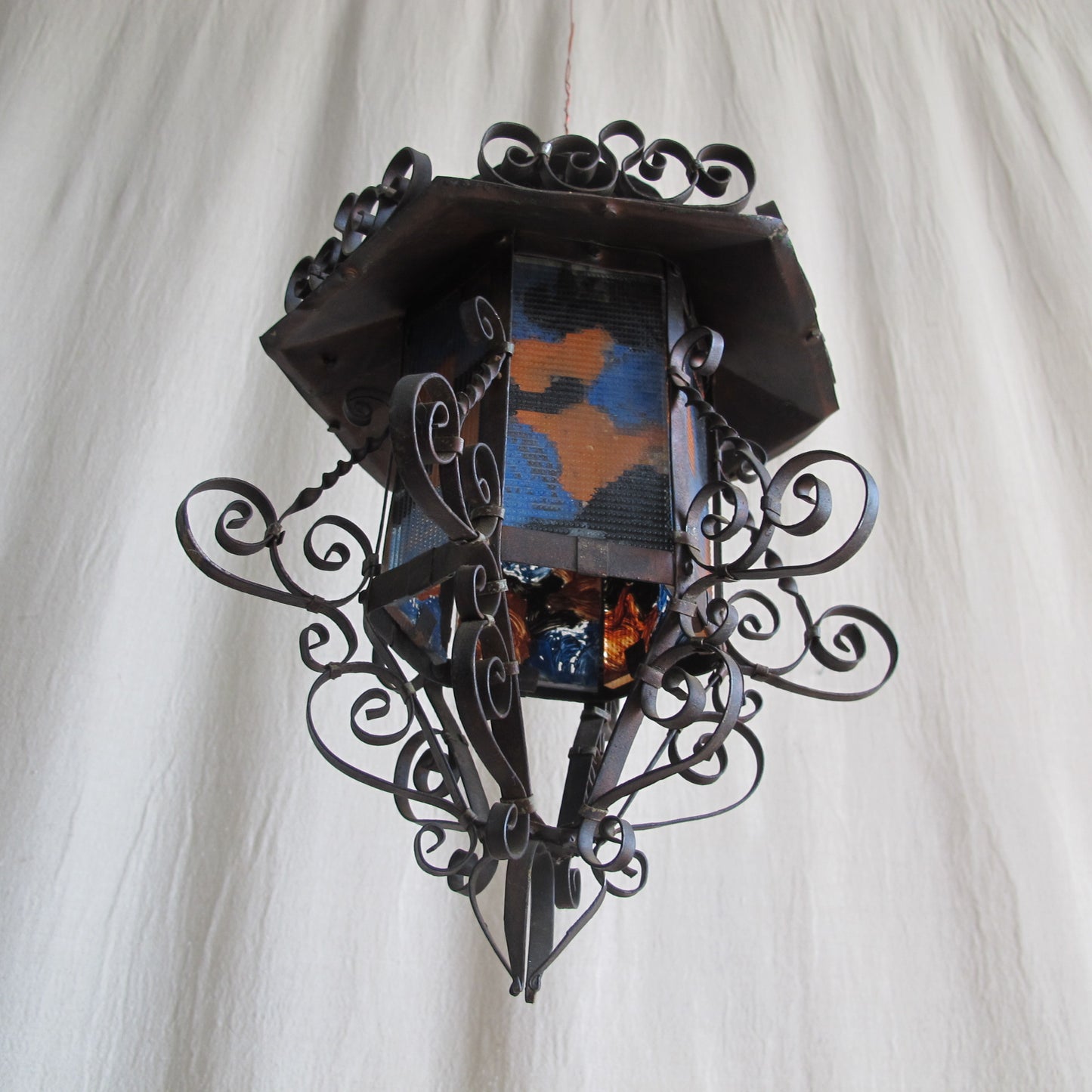 Rare 1920s California Spanish Colonial lantern in delicately wrought copper and reverse painted glass