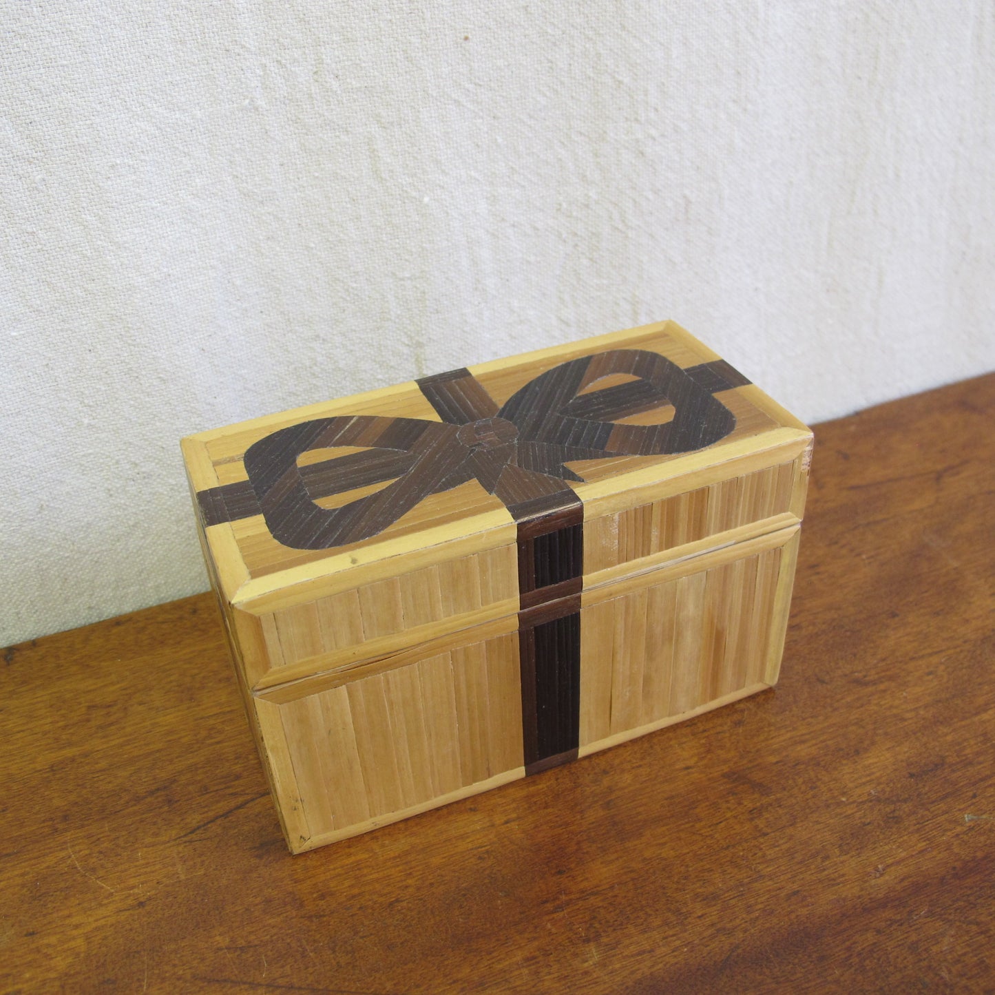 French straw marquetry box made by Rochas in the form of a gift box with bow, c. 1970