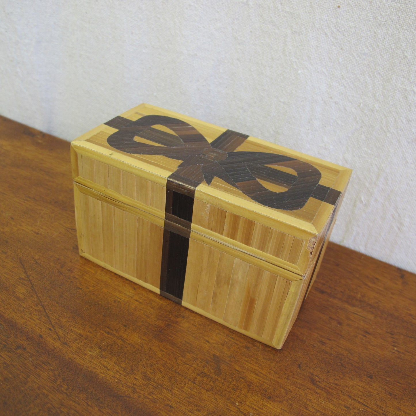 French straw marquetry box made by Rochas in the form of a gift box with bow, c. 1970