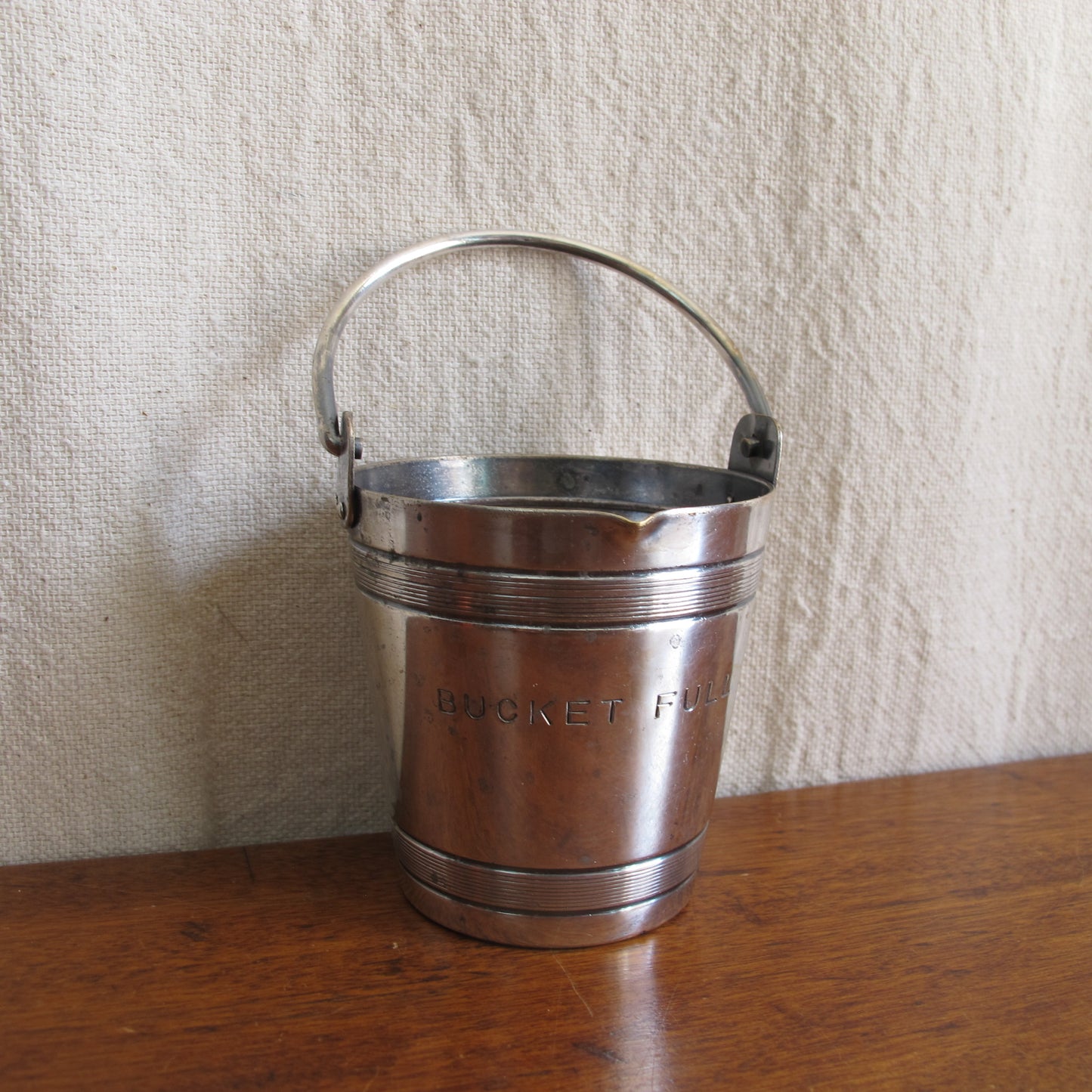 Cocktail jigger engraved "BUCKET FULL," in the form of a miniature bucket, up to 4 oz., silverplate by Napier, c. 1930