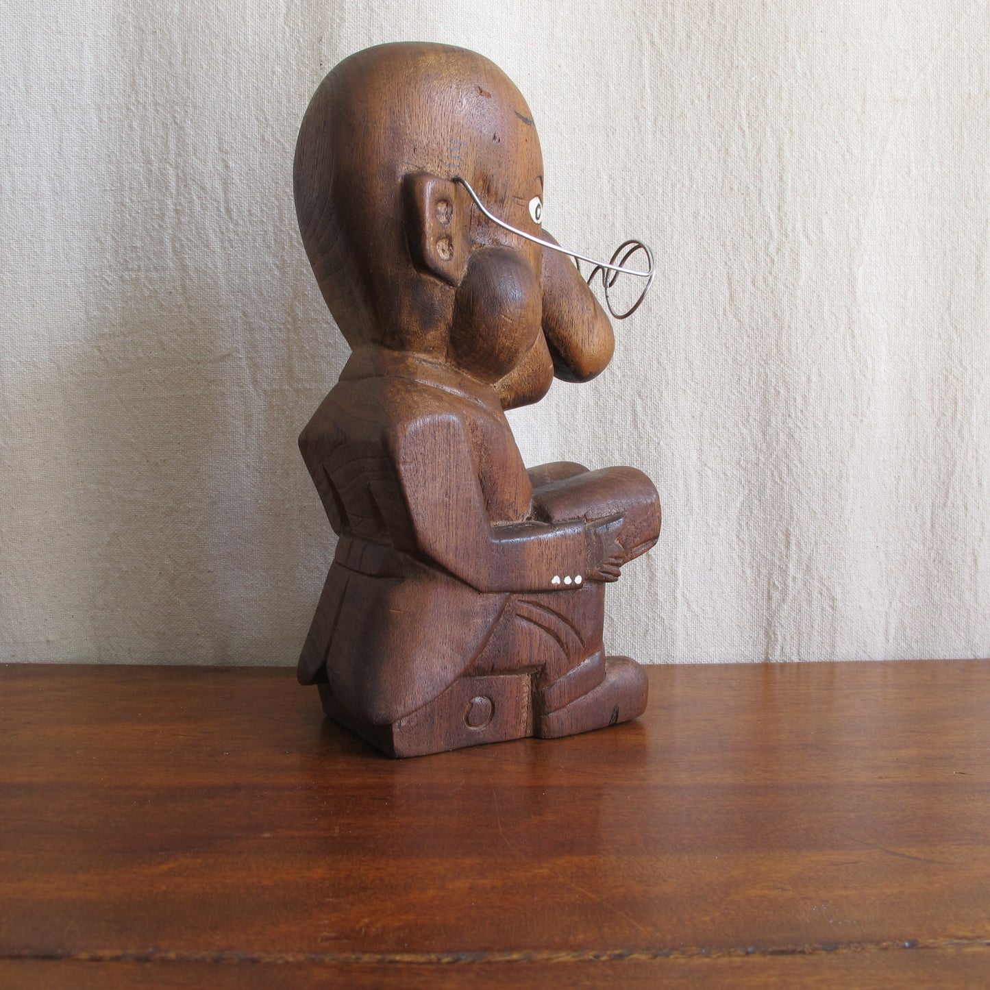 3D caricature of an unknown sitter or character, seated reading with a bulbous nose, suit with tails, glasses, c. 1930 vintage antique