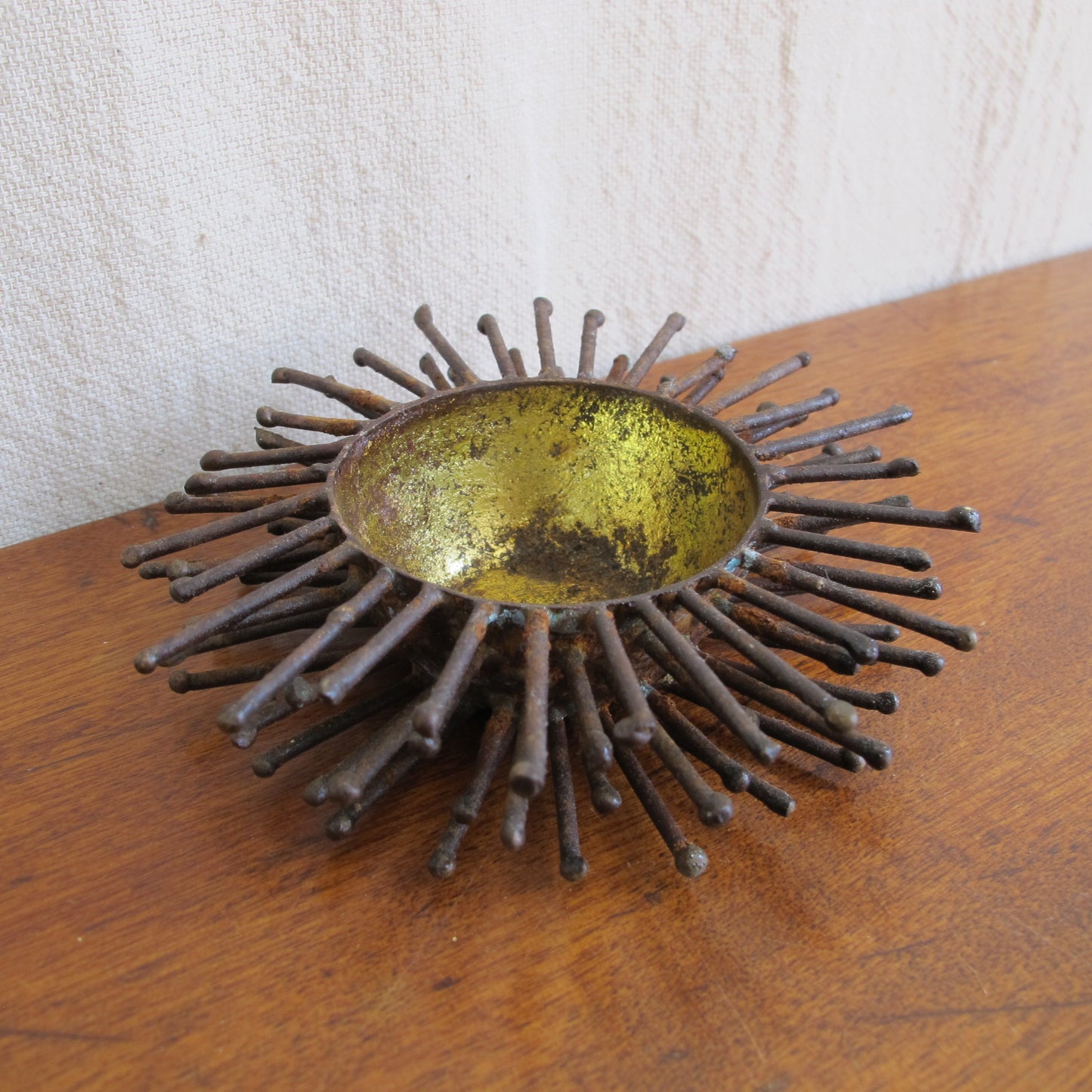 Brutalist spiked bowl with gilded interior, rather like a sea urchin, sculptural on the table or wall, c. 1970