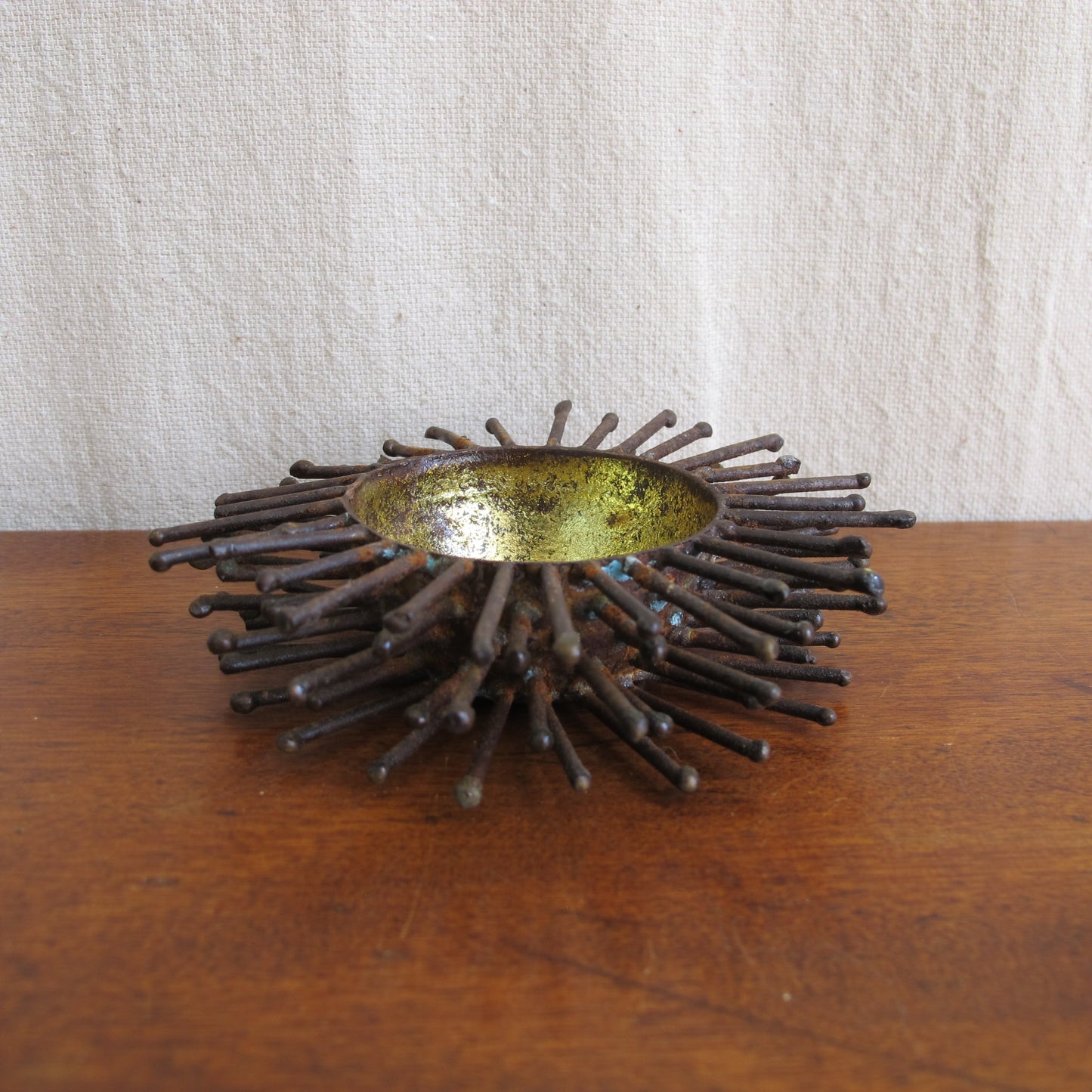 Brutalist spiked bowl with gilded interior, rather like a sea urchin, sculptural on the table or wall, c. 1970