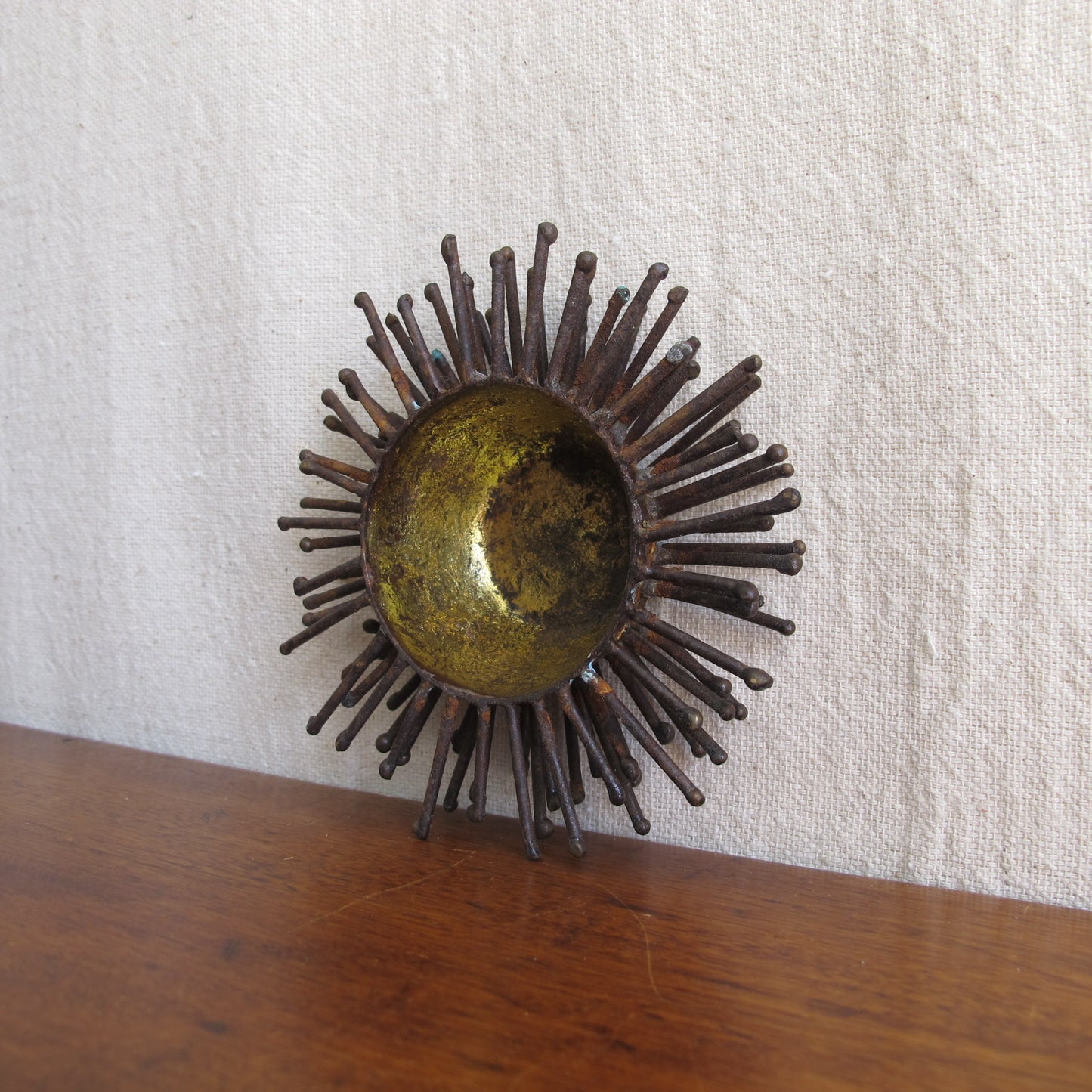 Brutalist spiked bowl with gilded interior, rather like a sea urchin, sculptural on the table or wall, c. 1970