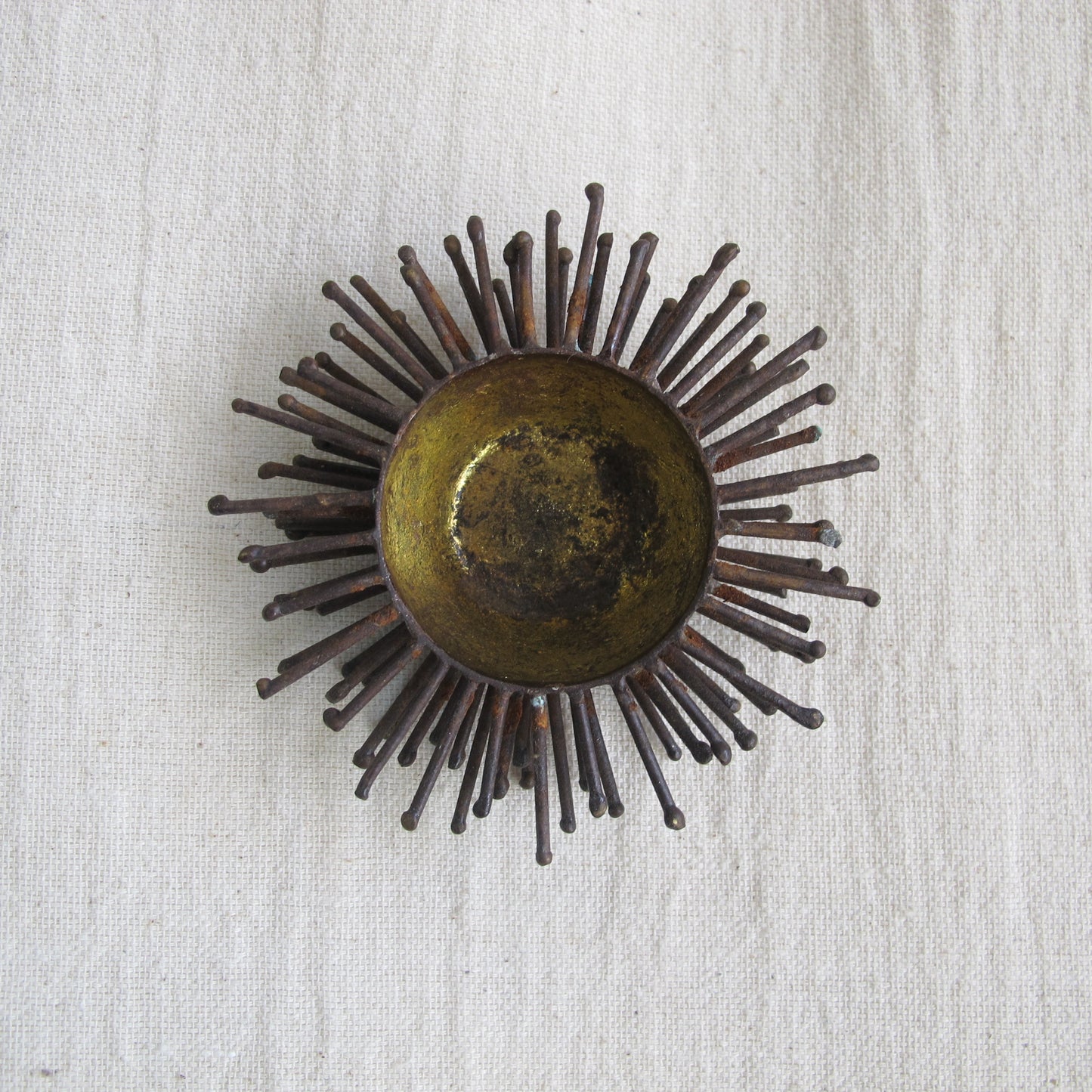 Brutalist spiked bowl with gilded interior, rather like a sea urchin, sculptural on the table or wall, c. 1970