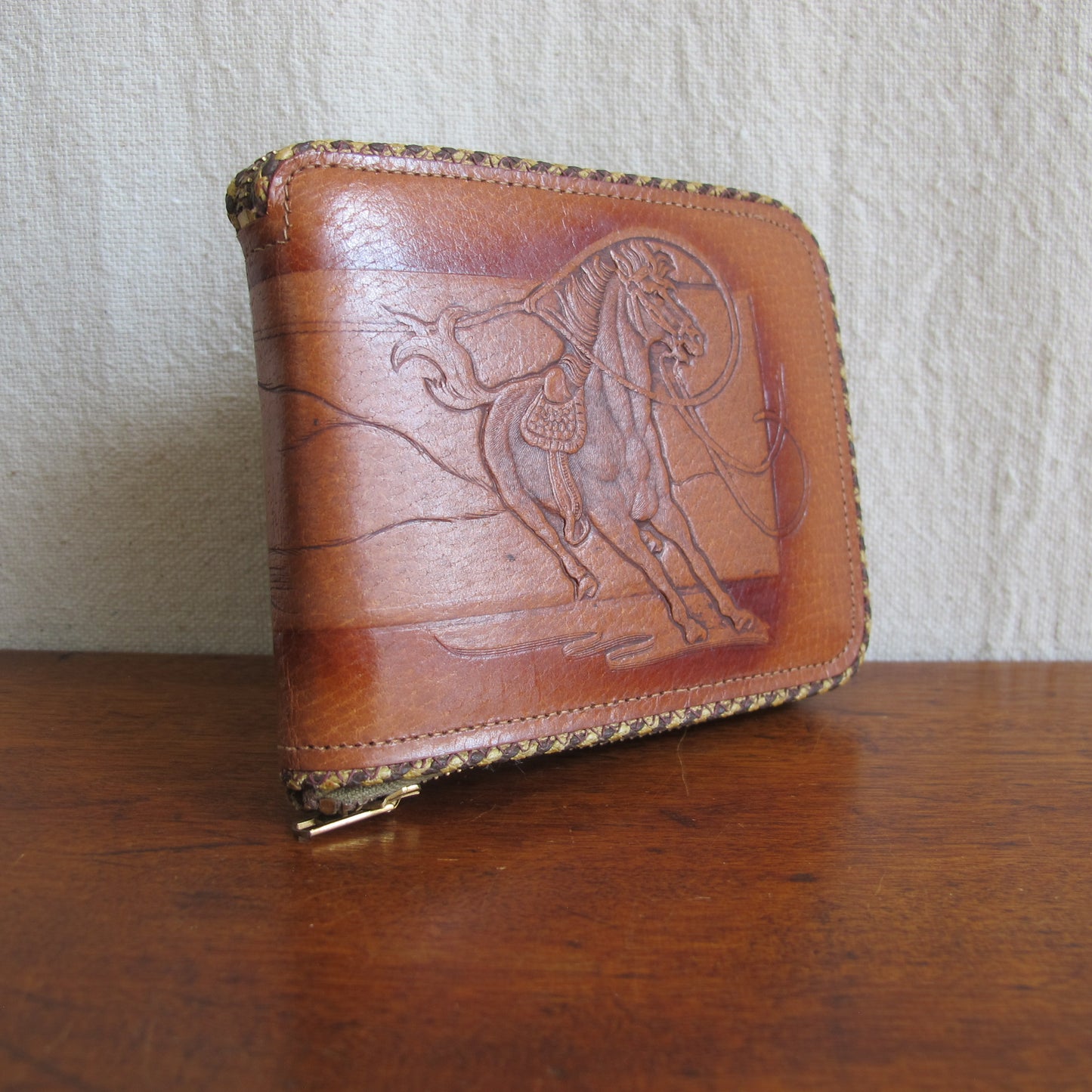 Wallet in tooled pigskin leather cowboy and mustang horse being lassooed, by Hidecraft, perfect unused condition, c. 1940