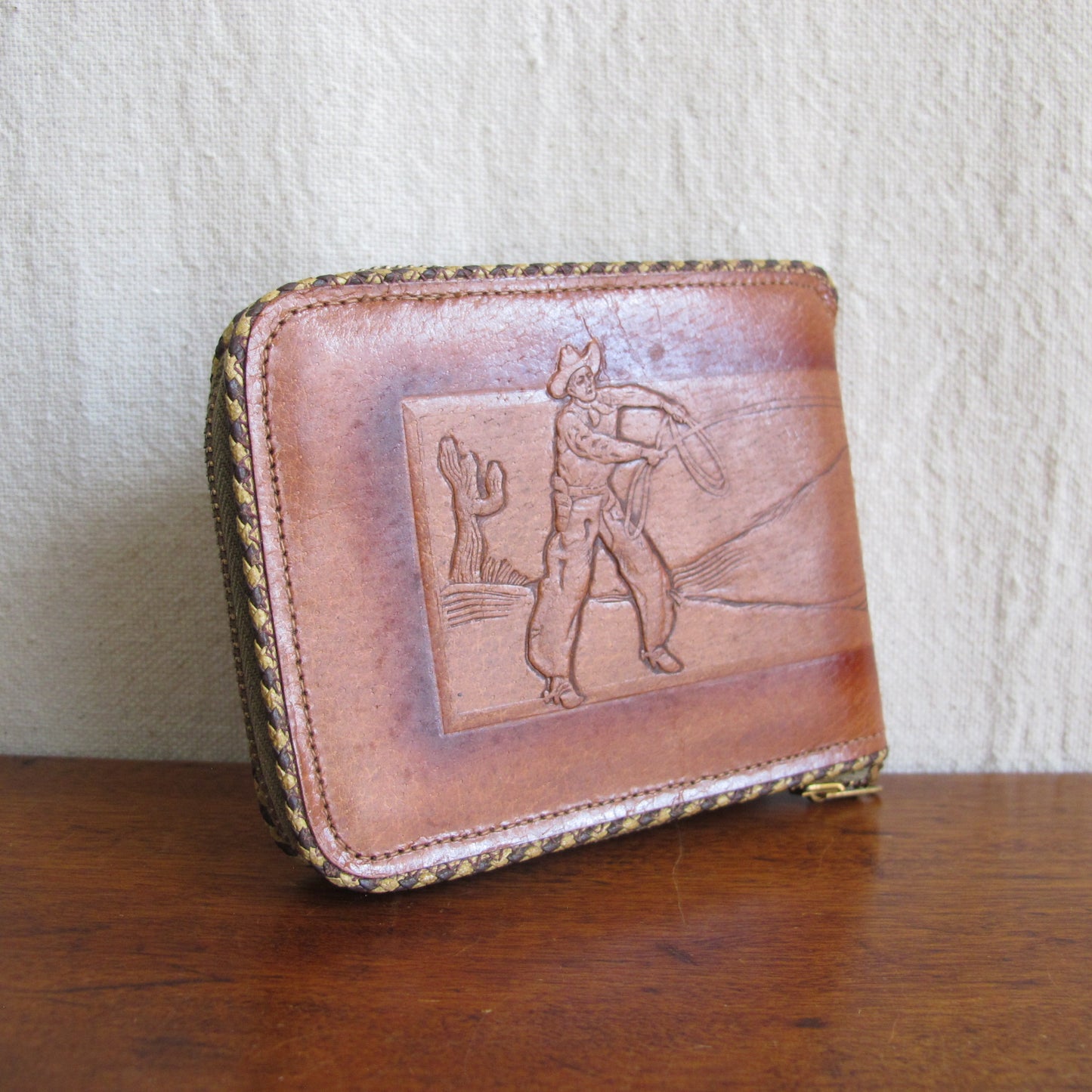 Wallet in tooled pigskin leather cowboy and mustang horse being lassooed, by Hidecraft, perfect unused condition, c. 1940