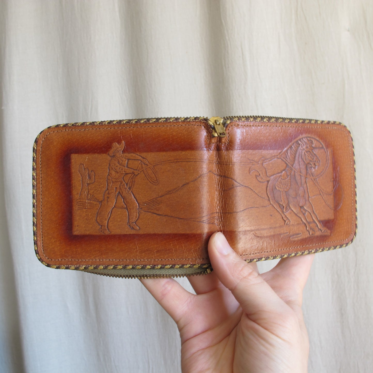 Wallet in tooled pigskin leather cowboy and mustang horse being lassooed, by Hidecraft, perfect unused condition, c. 1940