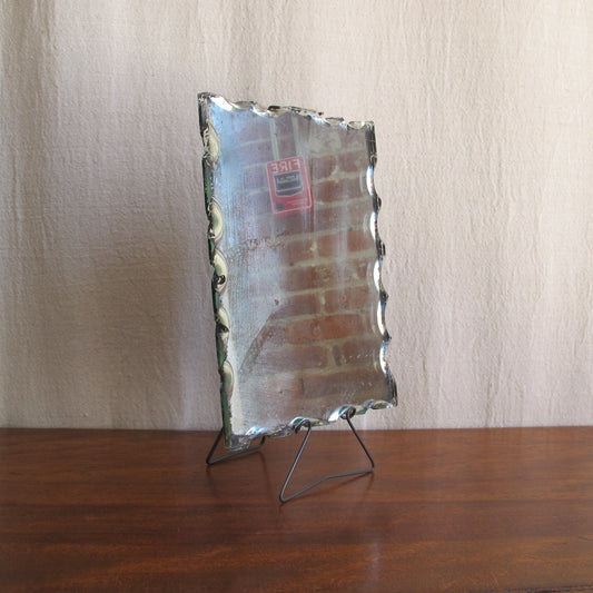 Edwardian dressing or shaving mirror, c. 1900 1910, with unusual intentionally chipped edges and wireframe stand, antique vintage