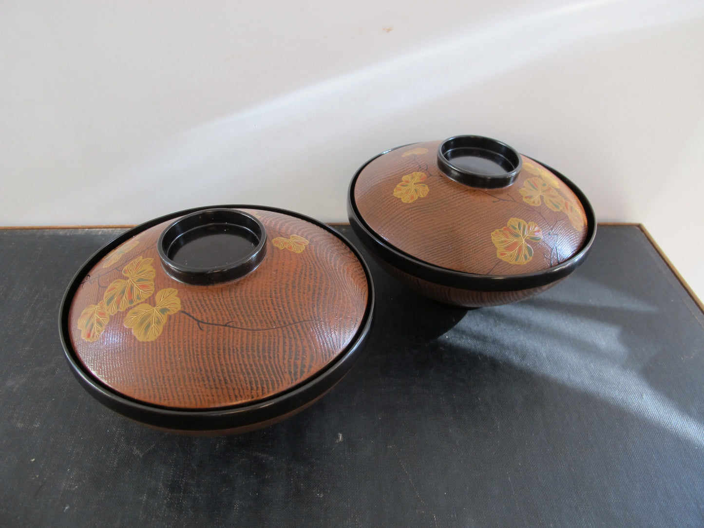 Japanese Lacquer Covered Bowls Pair Midcentury c. 1960 Faux Bois Black Gold Orange Green Autumnal Fall Grape Leaves Lids as Bowls